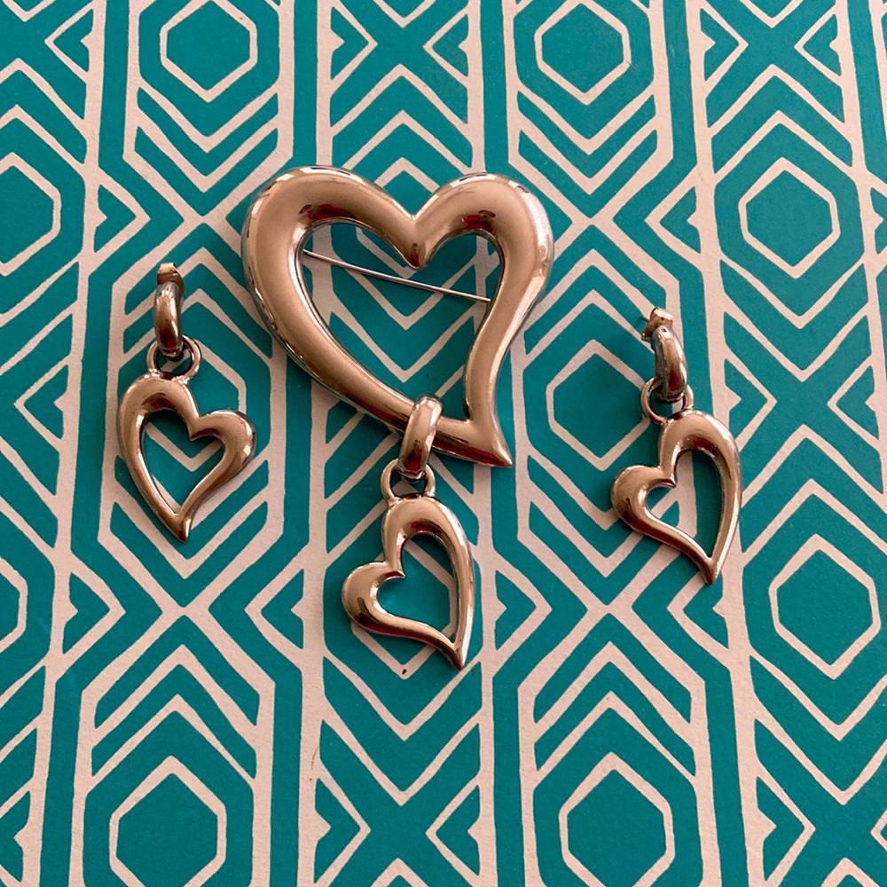 Silver hearts, brooch and (pierced) earrings.